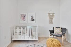 a bedroom with a bed and a chair in a room
